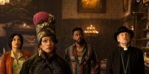 (L-R): Rosario Dawson as Gabbie, Tiffany Haddish as Harriet, LaKeith Stanfield as Ben, and Owen Wilson as Father Kent in Disney's live-action HAUNTED MANSION