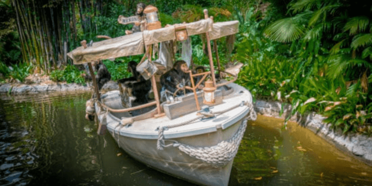 Monkey animatronics take over a white boat on the Jungle Cruise.