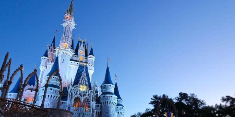 An evening photo of the Cinderella Castle inside of Disney World, Magic Kingdom